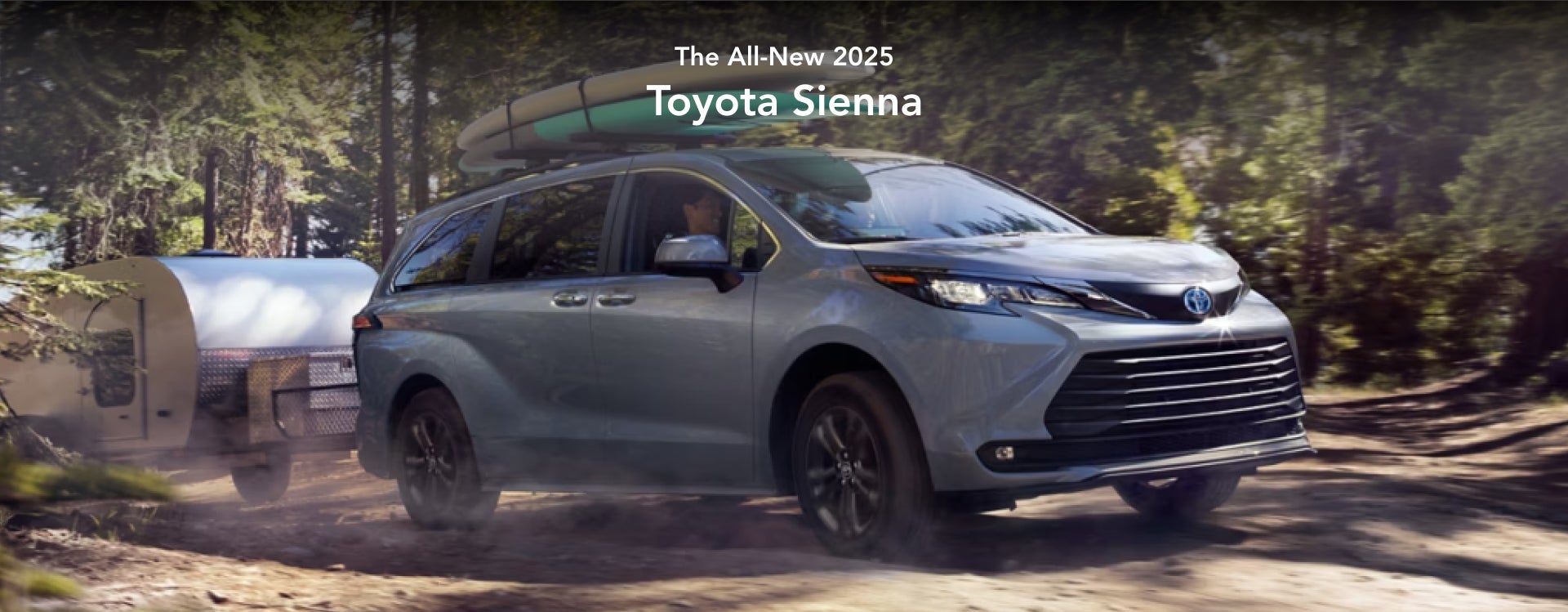 Toyota Sienna driving with a camper attached