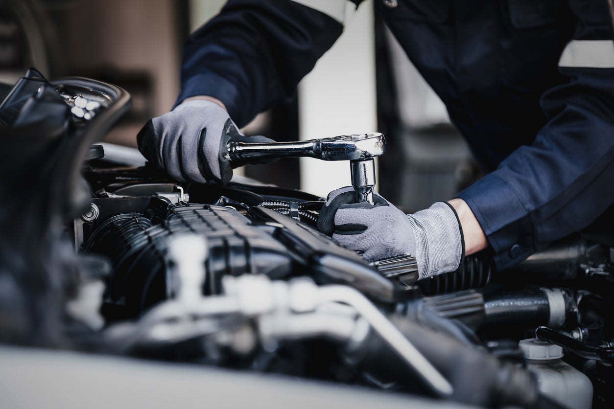 Technician under the hood